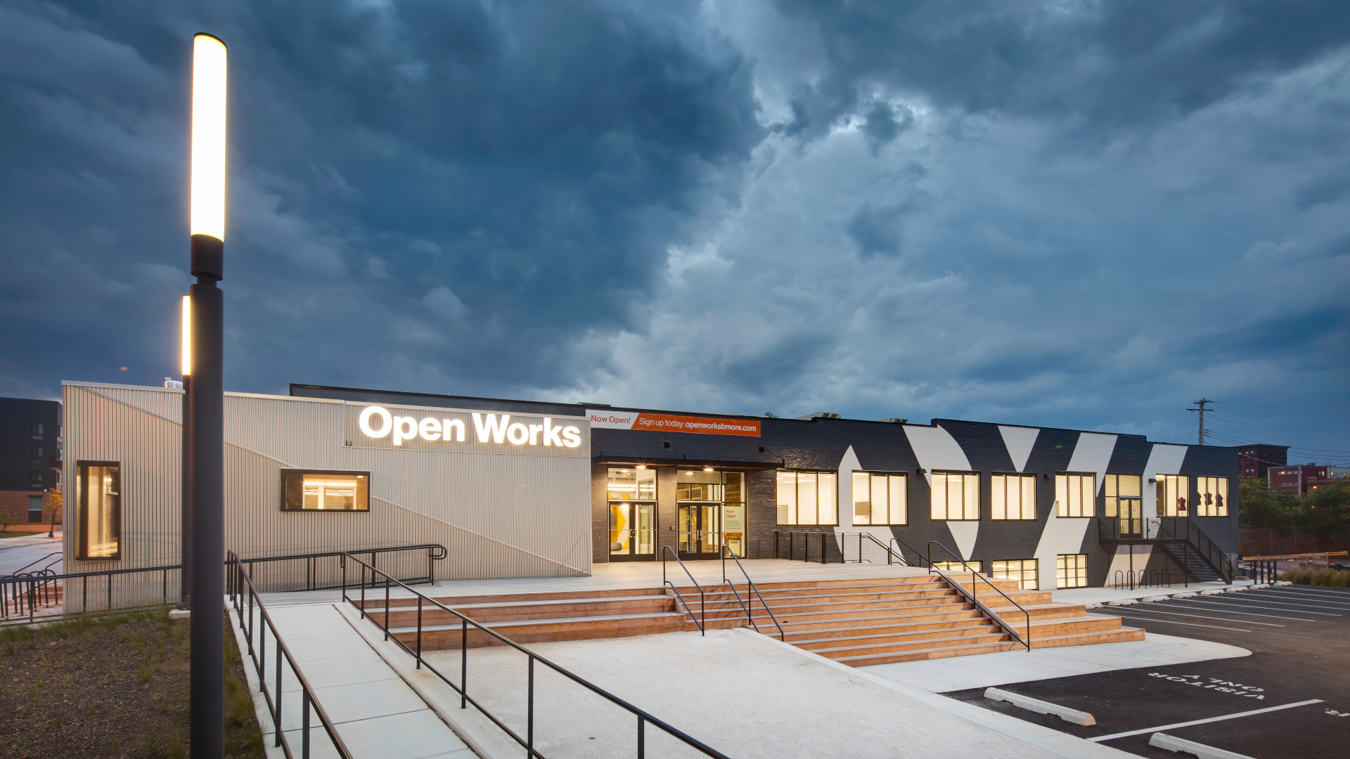 Picture of the Open Works building at twilight on a cloudy day. It's a moody image.