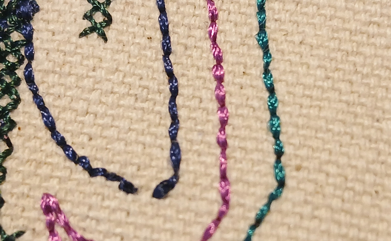 Three parallel lines of bean stitch.